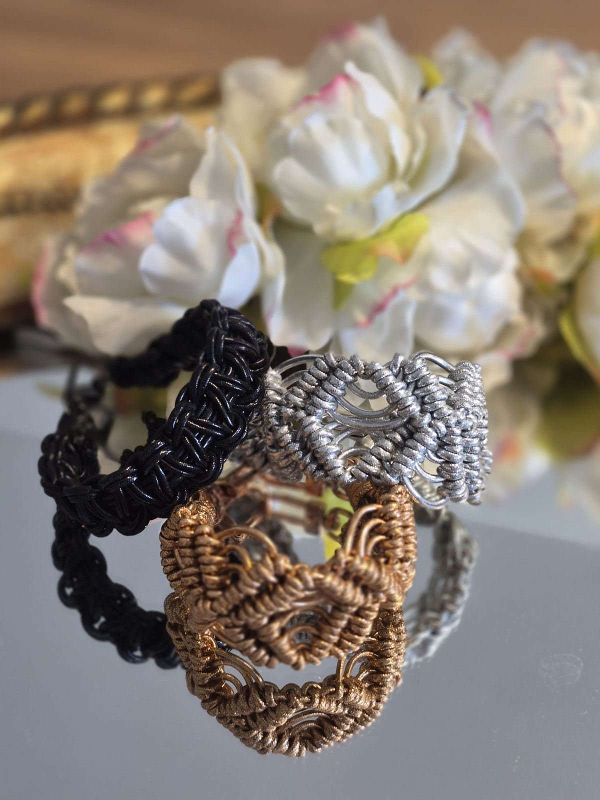 Trio de manchettes — noir, argent, bronze